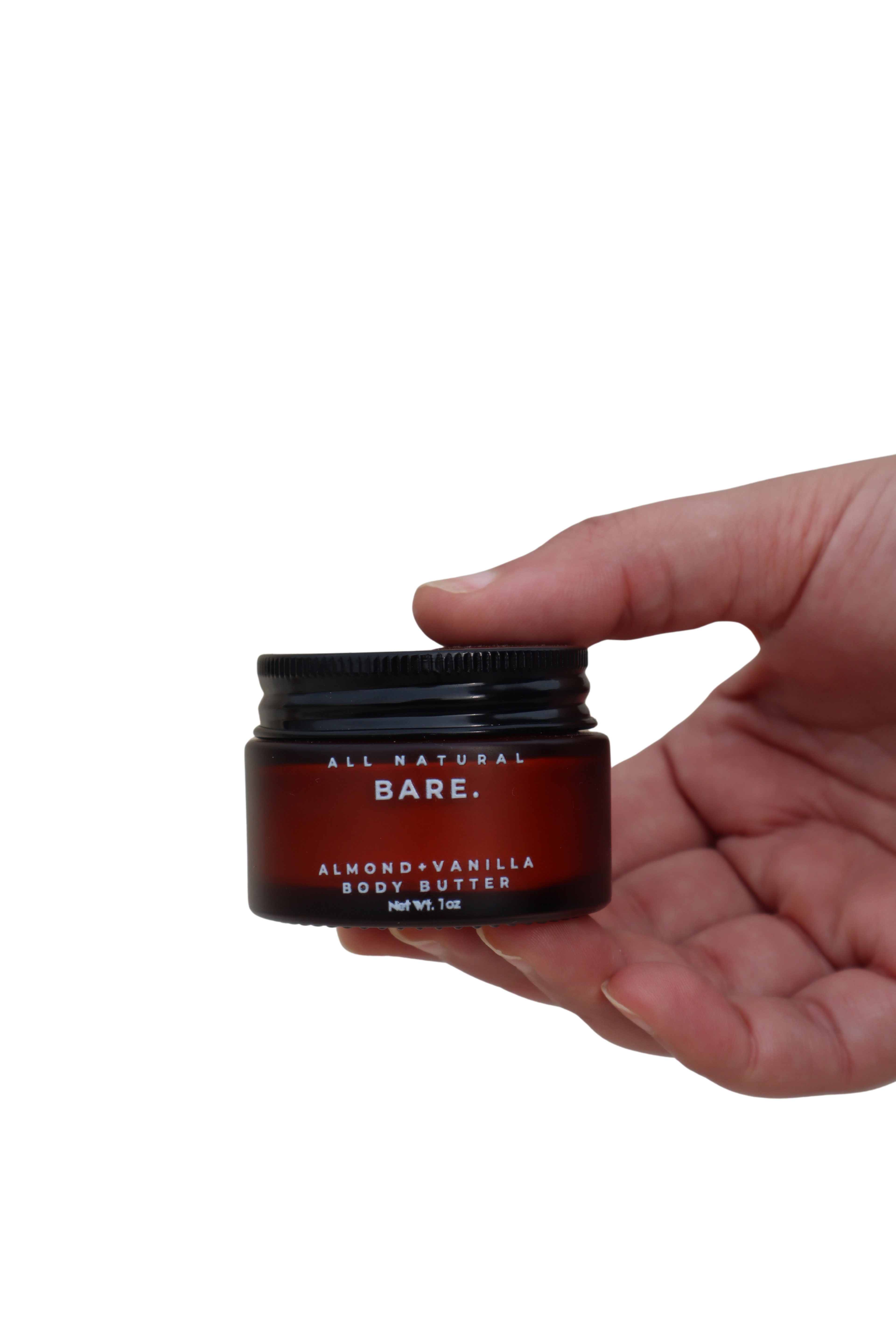 Almond & Vanilla body butter in a frosted amber 30ml glass jar held in a hand against a clean white background, rich tallow moisturizer for dry and very dry sensitive skin by Bare Naturals.