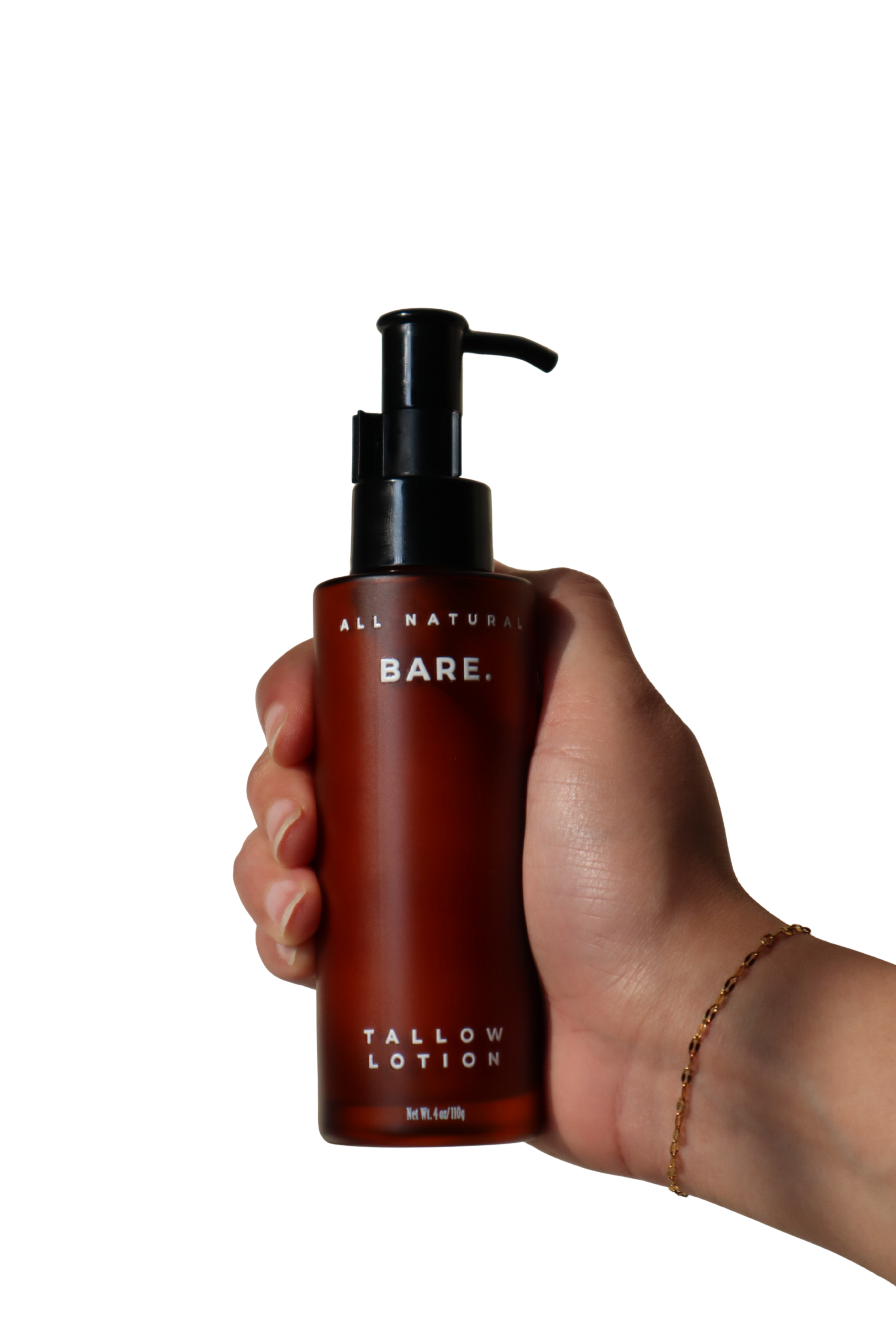 Hand holding a 106 ml frosted amber glass pump bottle of Bare Naturals Tallow Lotion against a clean white background, lightweight daily lotion that supports the natural skin barrier, gives long-lasting hydration, absorbs quickly with no residue, and is gentle for dry, normal and sensitive skin.